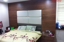 Bed frame with wall feature