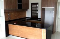 Wood Grain Kitchen Cabinet with Black Marble Top